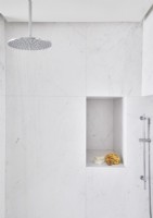 White marble shower cubicle with alcove shelf
