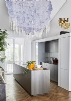 Decorative fabric wall hanging in contemporary kitchen