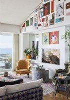Display of colourful modern artwork on living room wall 