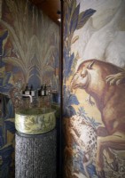 Small marble sink in classic bathroom with mural on walls