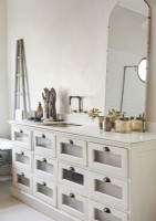 Vintage chest of drawers as sink unit in country bathroom