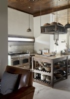 Large wooden island in country kitchen