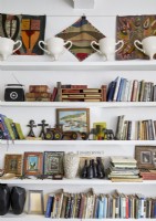Detail of shelves filled with books and ornaments