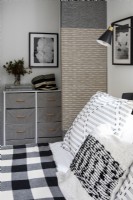 Bedroom details decorated in black, white and grey.