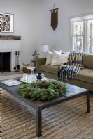 Coffee table with Christmas wreath decoration.