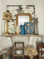 In the upstairs hallway, Anita created a display worthy of a French flea market. 