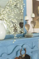 A simple vignette of favorite items celebrates French country style.