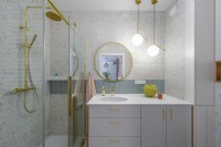Contemporary bathroom with gold trim elements