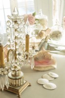 Vintage crystal and shells gathered on seaside strolls are favored accessories.