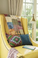 Mixing patchwork quilts and brightly patterned pillows creates aâ€œcollected over timeâ€ look.