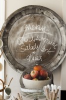 Function meets imagination in an easy to clean zinc platter turned blackboard for grocery lists, messages or menus. 
