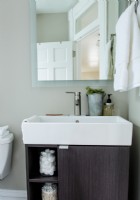 Though small, the bathroom is replete with modern updates.
