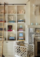 Built-in bookshelves keep favorite tomes and a collection of shells neatly organized.