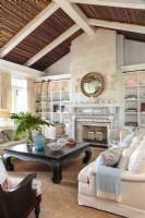 The living room embodies the seaside elegance of West Indie style.