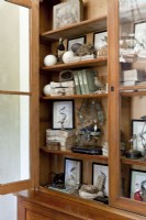 A hutch holds items that reflect the coupleâ€™s affinity for nature and preference for earthy textures. 