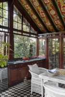 Garden room with folk art style painted ceiling