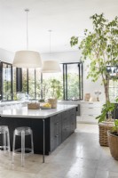 Pendant light fittings suspended over kitchen island
