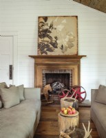 White walls establish a neutral backdrop for unfussy country furniture and artwork. 