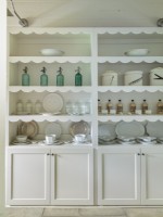 A scalloped edging on the built-in cupboard tips the scales toward nostalgic. 