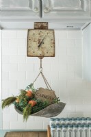Prized for its patina, a scale makes handy spot for whimsical displays.