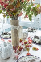 Flowering branches and apples make an organic centerpiece.