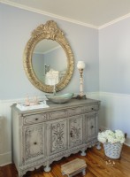 A sideboard is recycled as a vanity.