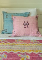  Two cactus silk pillows  pick up the colors of an old kantha quilt.