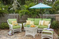 Patio setting with wicker furniture.
