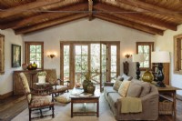 Old redwood beams crown the simply yet visually powerful living room.