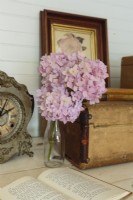 The antique mantel clock doesnâ€™t work but adds charm to the setting.