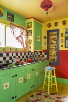 With its fruit-color walls and trim the kitchen sizzles 