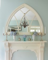 A Gothic mirror and fireplace surround.
