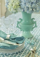 A blue 1940s vase and silverware are family heirlooms.