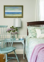 he master bedroom continues the theme of mixing old and new and the color palette.