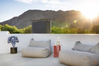 Outdoor furniture on rooftop with mountain views