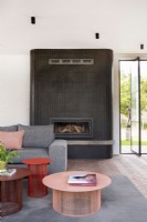 Fireplace with tile cladding in living area