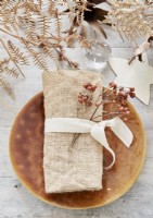 Detail of rustic dining table place setting