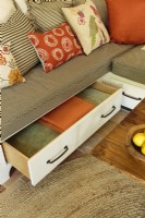Underneath the sofa, drawers provides storage below for fresh linens and cozy throws.
