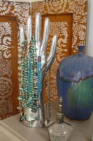 Necklaces, pottery, and a bottle from Marrakech sum up Debbie's local-meets-global style.