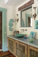 Four screen doors and a carved wooden beam were the starting point for the master bath. 