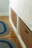 At the foot of the bed, basket offer easily accessible storage.