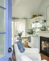 The front door opens right into the living area and heralds the cottage blue color accents.