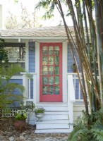 A red door symbolizes the energy of new opportunities, good luck, and protection.