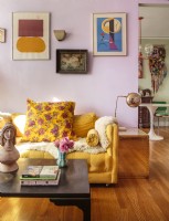 To balance the lavender walls and yellow sofa, Bridget uses rich blues and dark reds.