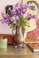 A vintage, hammered-copper pitcher makes a fitting vase.