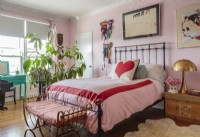 A pink, turquoise and red palette infuses romance into the bright and airy bedroom.
