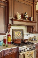 Italian and French jugs and pots infuse the kitchen with Mediterranean vibe.