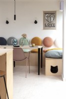 Modern open plan kitchen dining room with pastel accessories