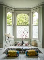 Oriental styled bay window with window film privacy.