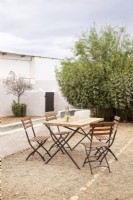 Farm courtyard set up with outdoor dining furniture 